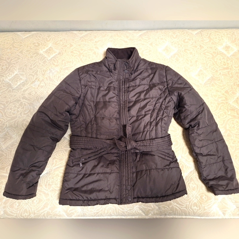 A Helium puffer jacket in chocolate brown and a ladies size medium.